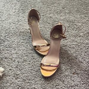 These are Heart In D metallic gold heels, size 8